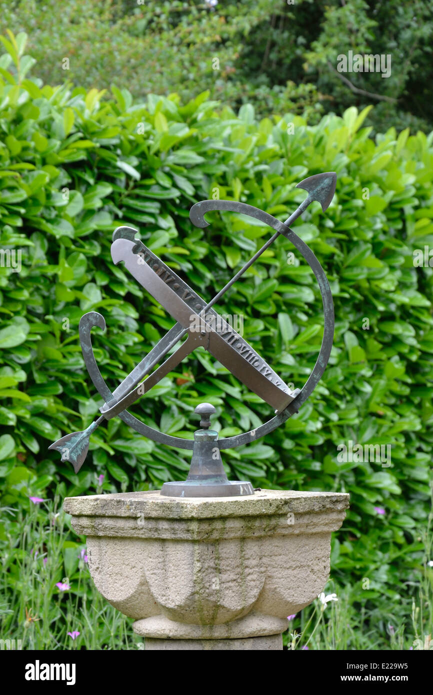 sun dial with hedge Stock Photo