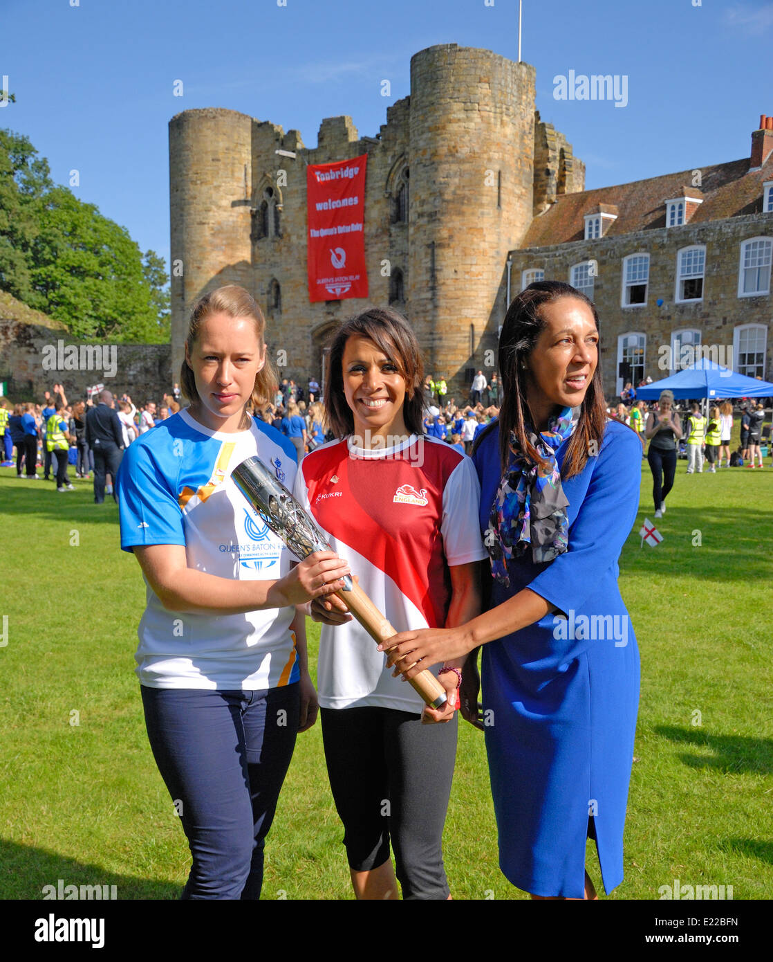 Dame Kelly Holmes, Lizzy Yarnold and Maidstone MP and Sports Minister Helen Grant hold the Queen's Baton in Tonbridge, Kent Stock Photo