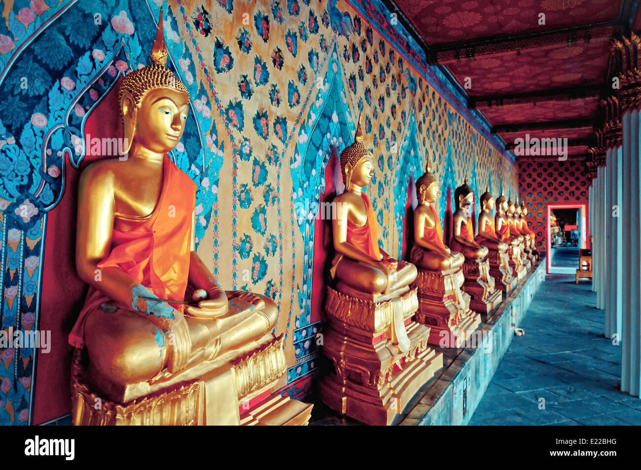golden statues of Buddha in Wat Arun temple, Bangkok - Thailand Stock Photo