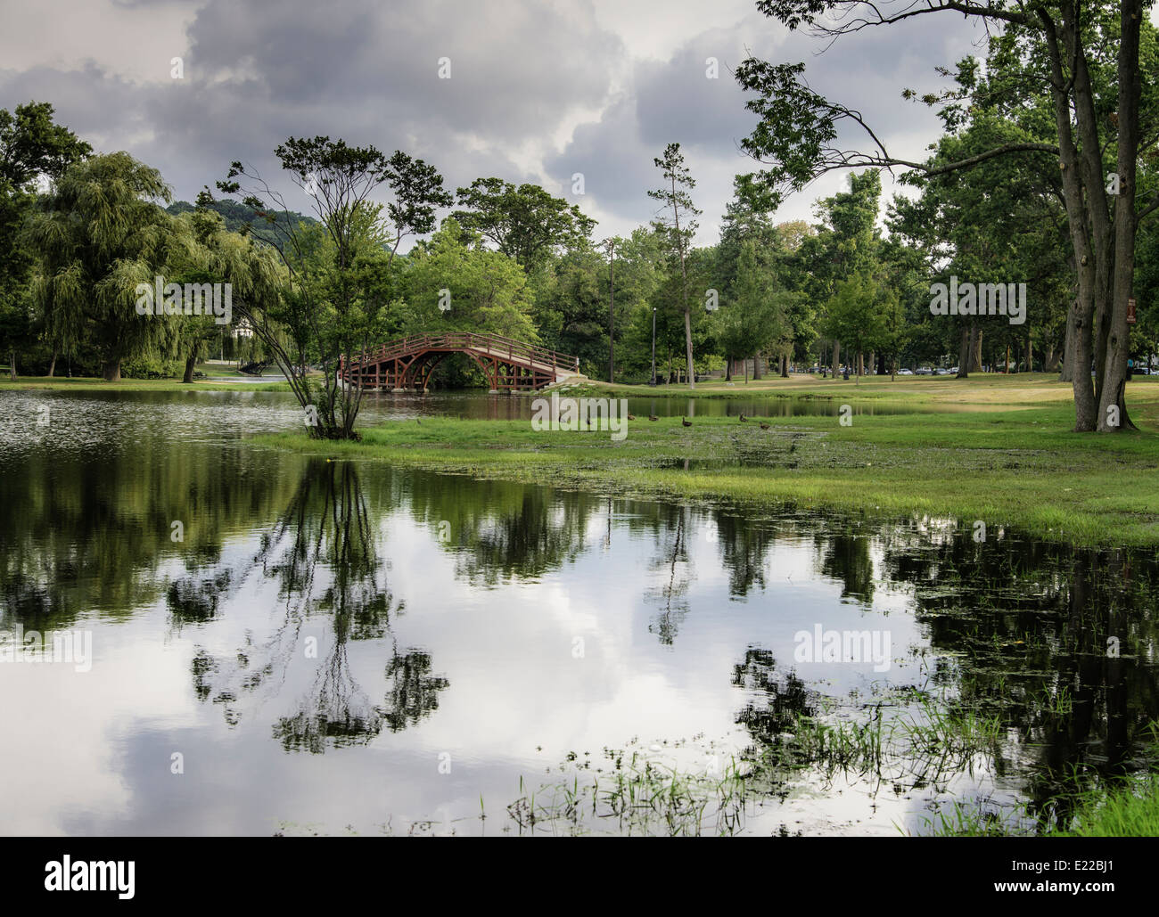 The Red Bridge and Pond in Elm Park, Worcester, Massachusetts Stock