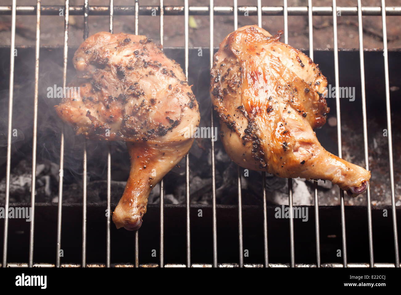 Roasting chicken with smoke from stove Stock Photo Alamy
