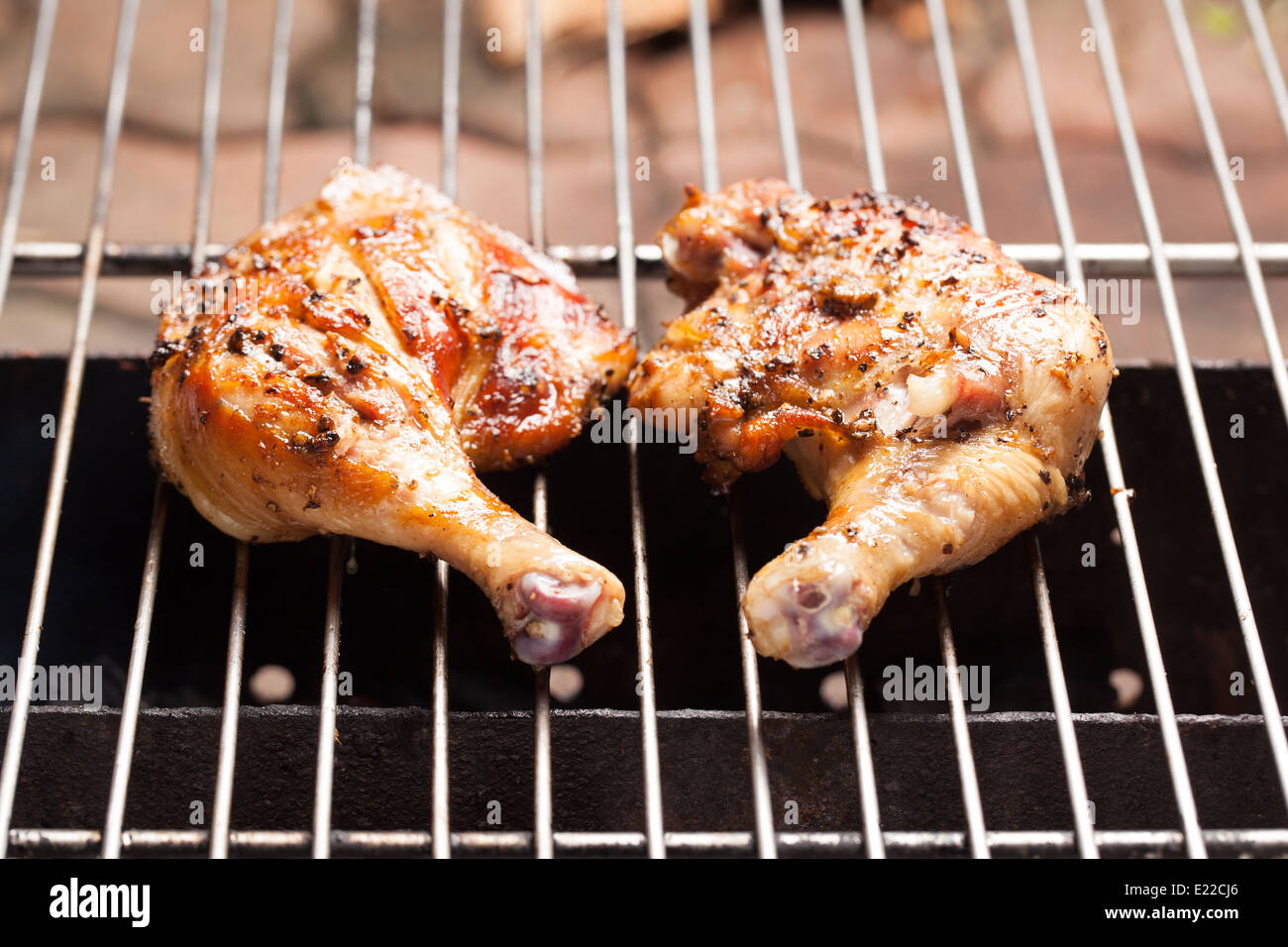Roasting chicken with smoke from stove Stock Photo Alamy