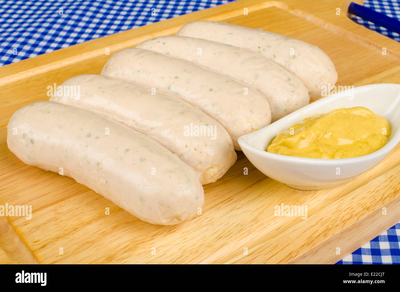 Raw Bavarian sausages with mustard, traditional food Stock Photo