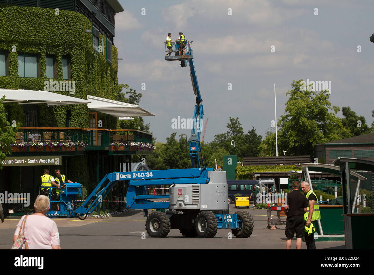 Wimbledon London 13th June 2014. Workers on a cherry picker at the AELTC All England Lawn Tennis Club ahead of the 2014 lawn tennis championships Credit:  amer ghazzal/Alamy Live News Stock Photo