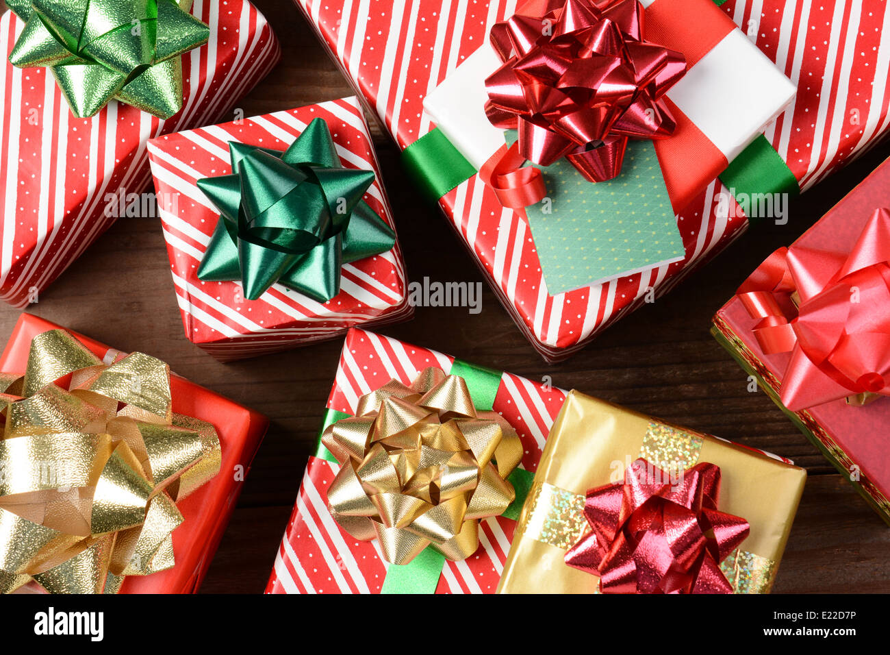 Overhead view of a group of wrapped Christmas presents. Horizontal format filling the frame. Stock Photo