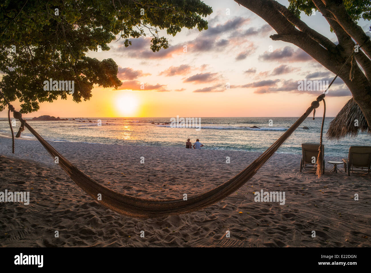 Sunset on beach with hammock at Punta Mita, Mexico. Stock Photo