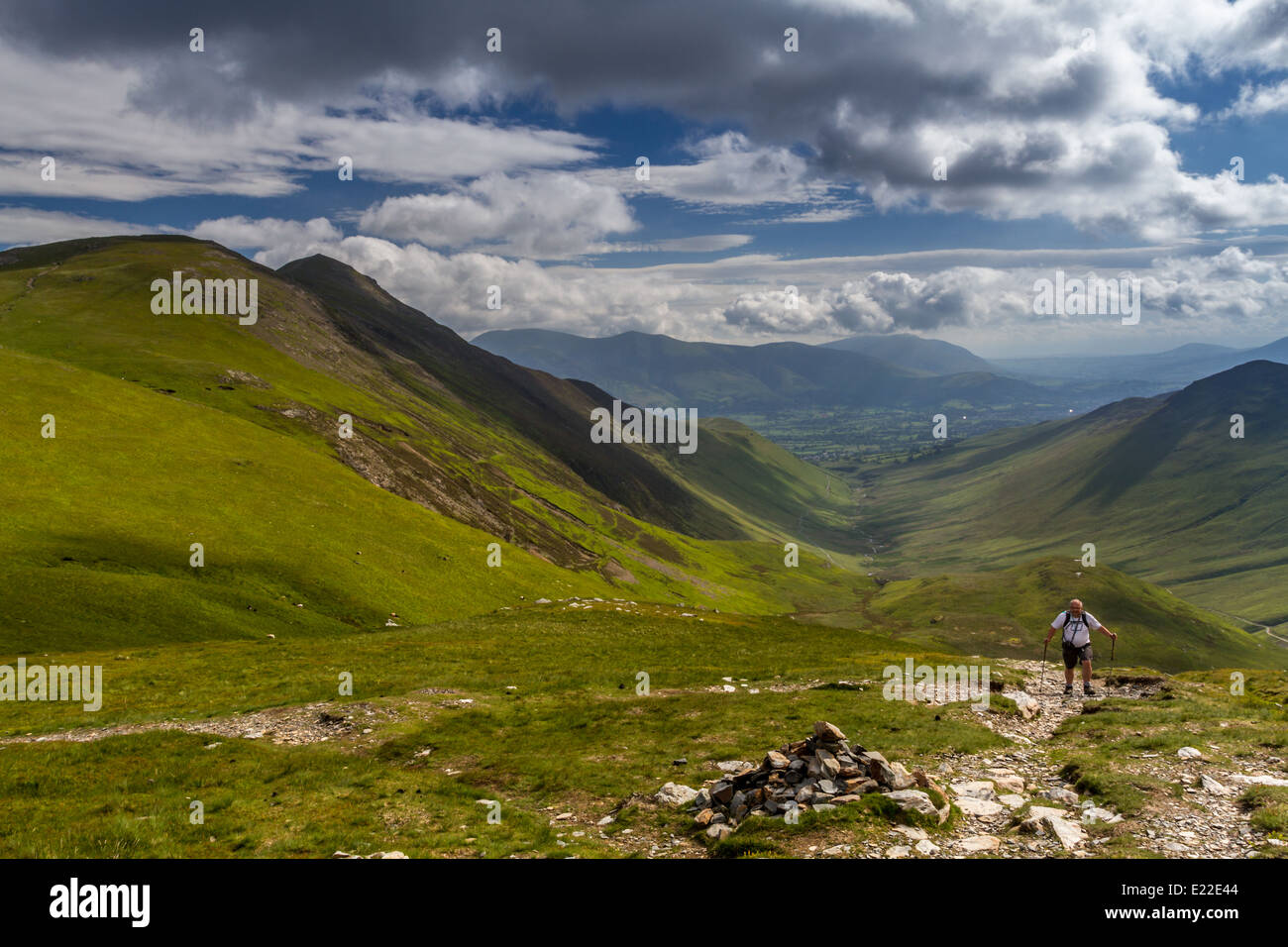 Walker on the Coledale Horseshoe with Grisedale Pike to the left.  English Lake District. Stock Photo