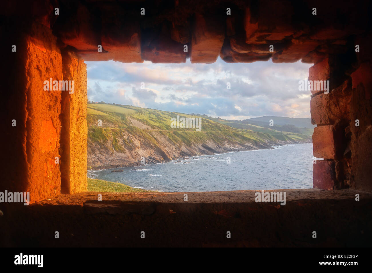 coast view inside of window frame of a fortress Stock Photo