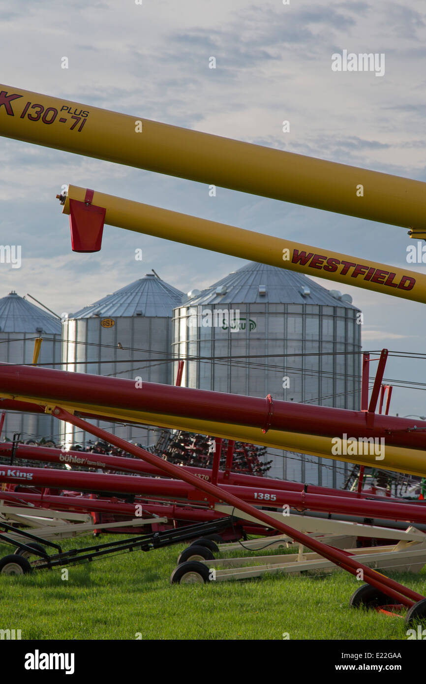 Maddock, North Dakota Grain augers next to gain storage bins Stock