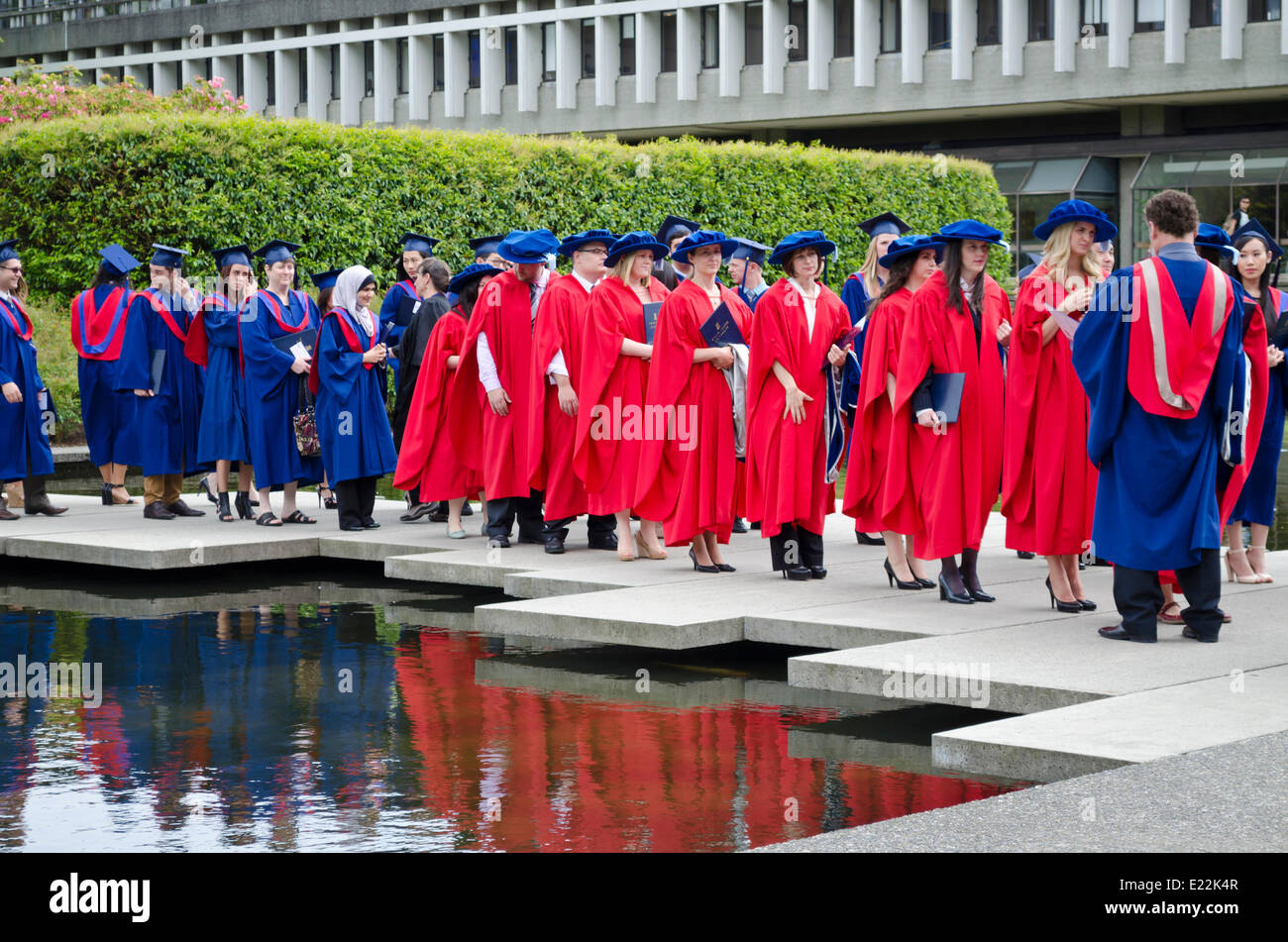 BURNABY, British Columbia,  CANADA.  JUNE 12, 2014:  Simon Fraser University graduands wait for the Spring 2014 convocation ceremony for the Faculty of Arts and Social Sciences to begin. Stock Photo