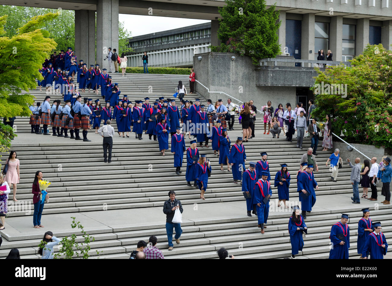 BURNABY, BC, CANADA.  JUNE 12, 2014:  Simon Fraser University graduands walk down the steps from the Academic Quadrangle towards the Convocation Mall.  The procession was part of the Spring 2014 convocation ceremony for the Faculty of Arts and Social Sciences. Stock Photo