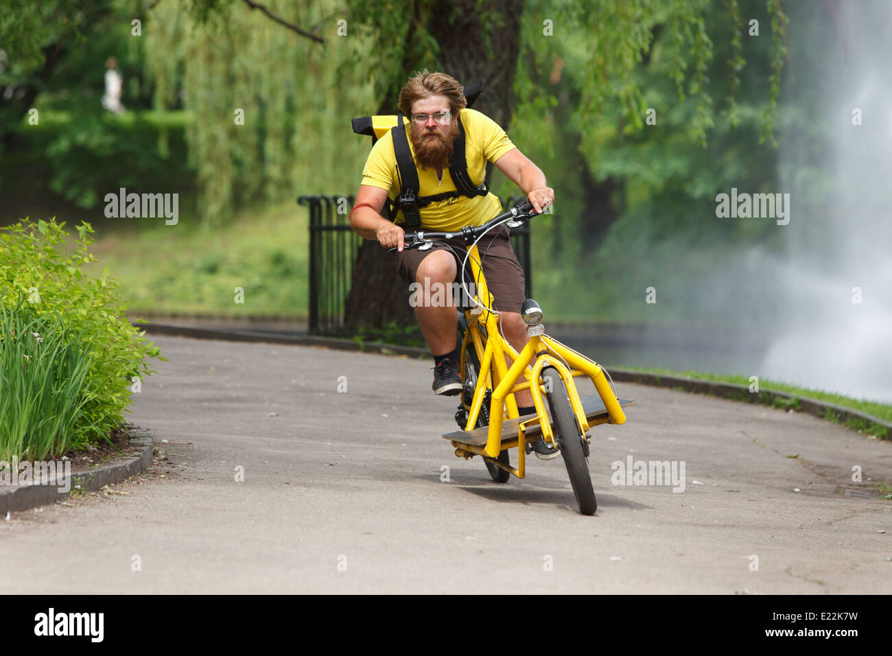 Bicycle messenger with cargo bike speeding for delivery Stock Photo