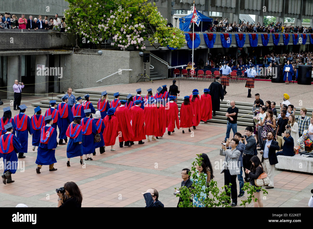 BURNABY, BC, CANADA.  JUNE 12, 2014:  Simon Fraser University graduands walk in procession towards the Convocation Mall during the Spring 2014 convocation ceremony for the Faculty of Arts and Social Sciences.  Credit: Maria Janicki/Alamy. Stock Photo