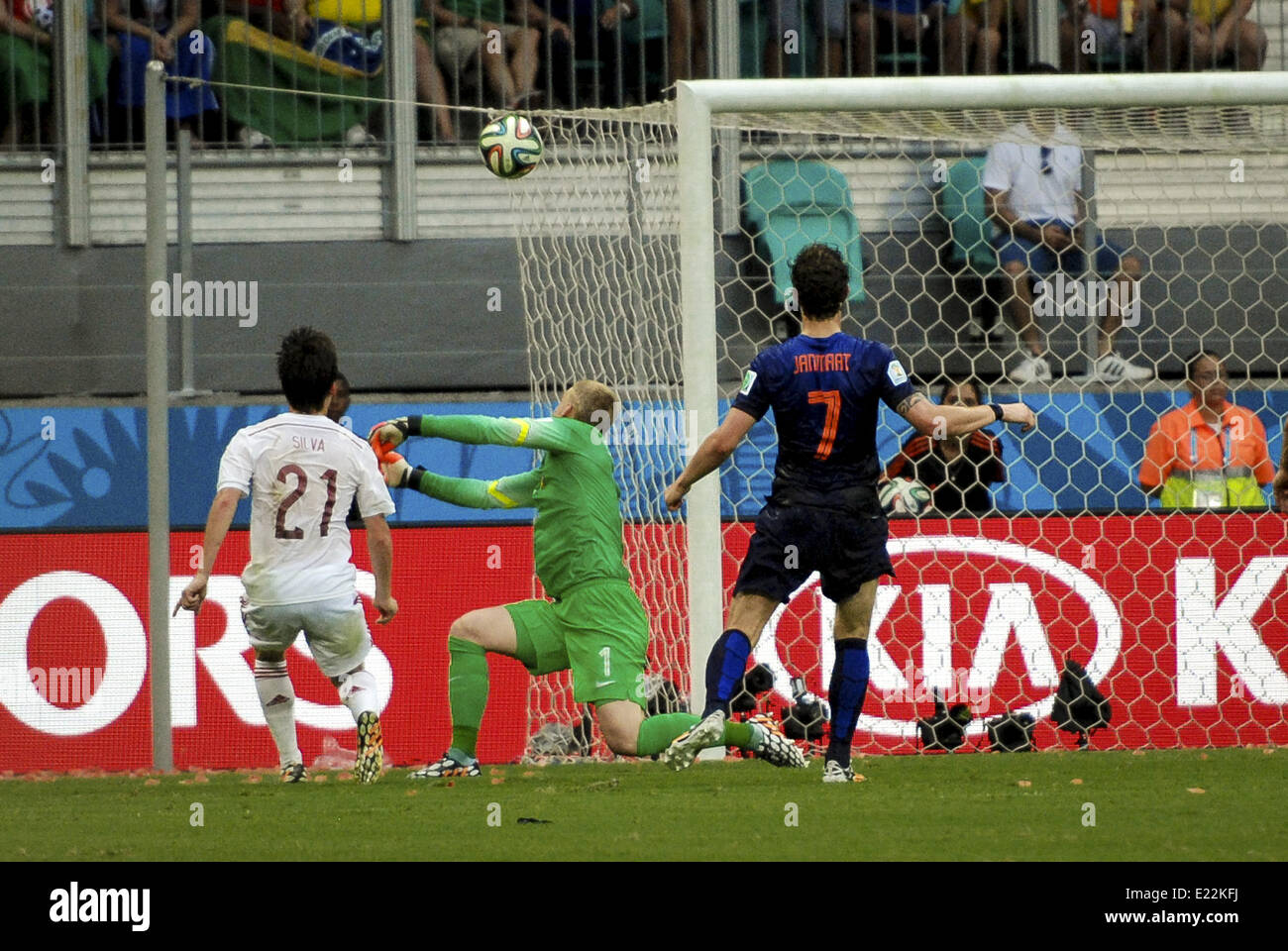 Salvador, Brazil. 13th June, 2014. Spain's David Silva, #21, tries without sucess to score against Netherlands' goalkeeper, Jasper Cillessen, #1, while chased by #7 Daryl Janmat, at the 2014 World Cup match between Spain and Netherlands, in Salvador, Brasil, this friday 13th Credit:  Gustavo Basso/NurPhoto/ZUMAPRESS.com/Alamy Live News Stock Photo