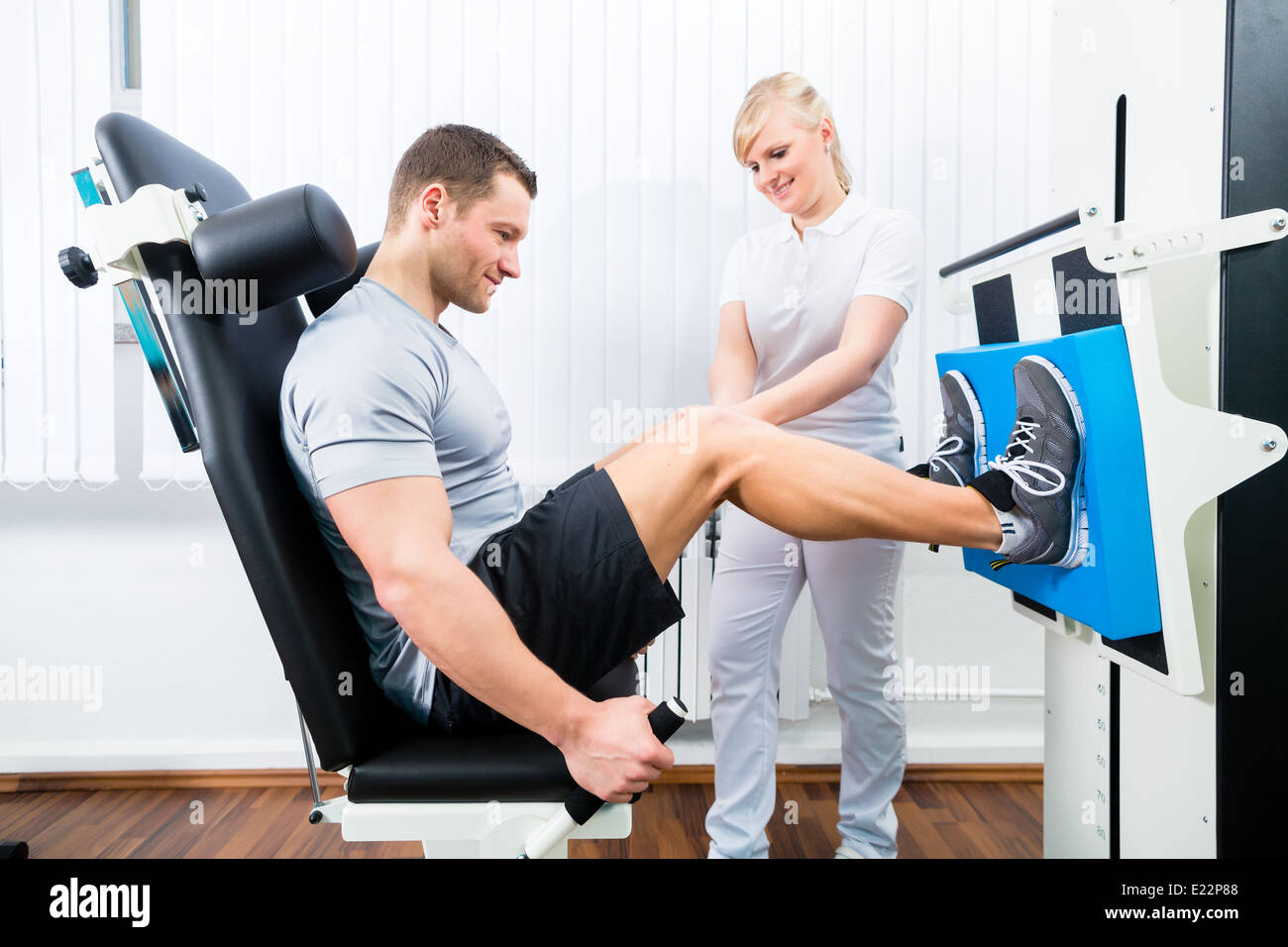Patient at the physiotherapy doing physical exercises using leg press
