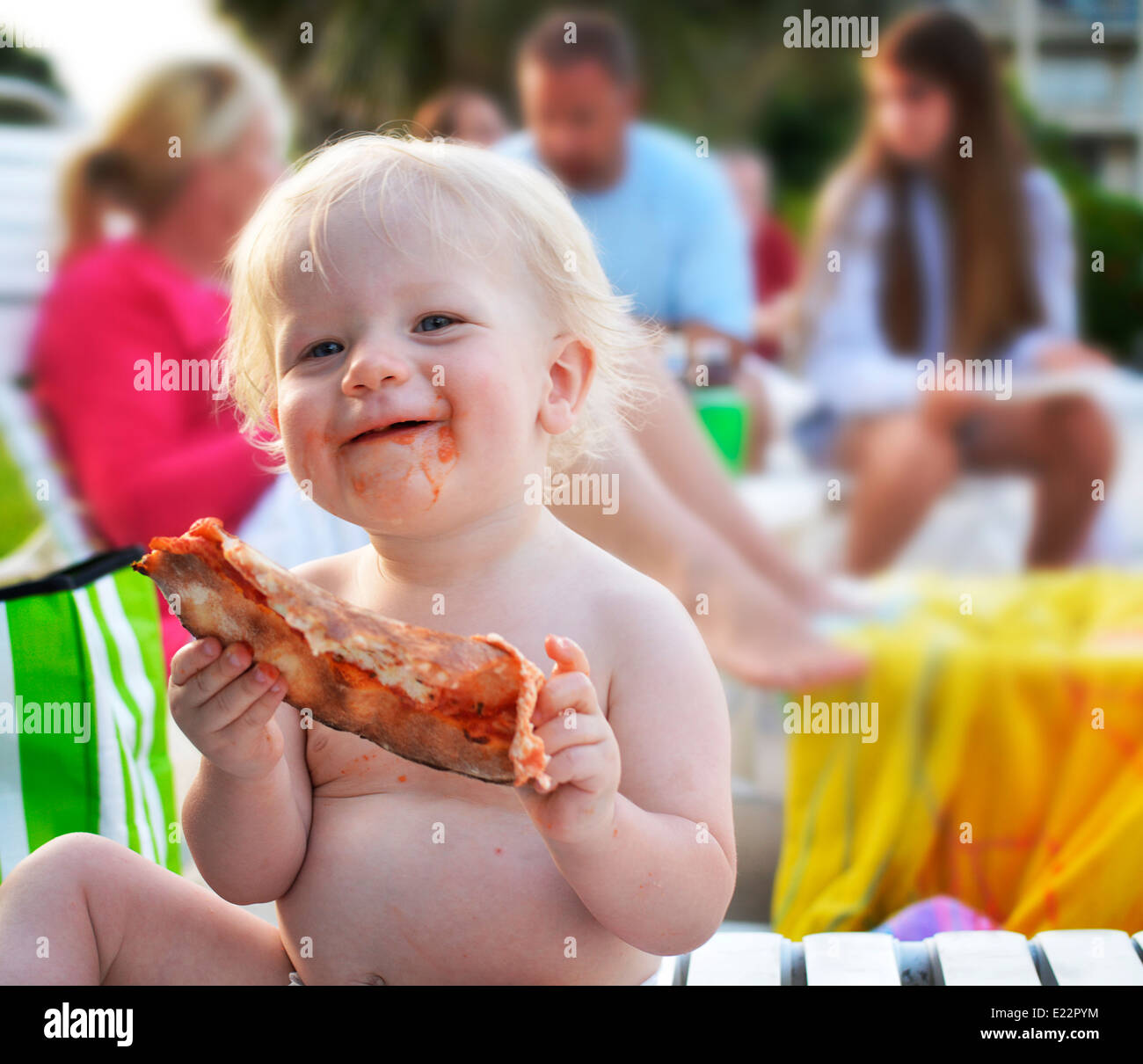 Happy baby eating Stock Photo
