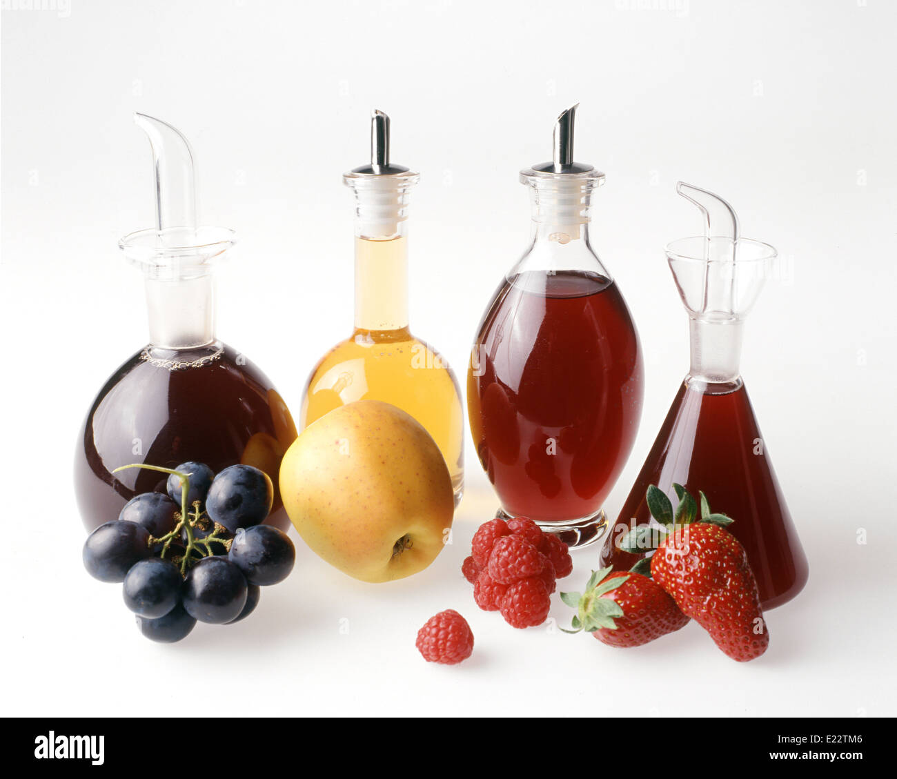 Four fruit vinegars Stock Photo