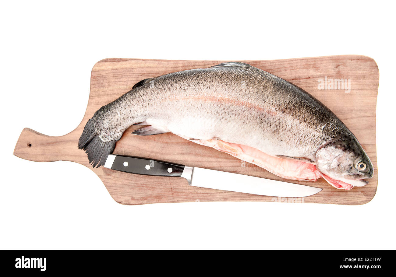 raw salmon trout fish on cutting board isolated on white background Stock Photo