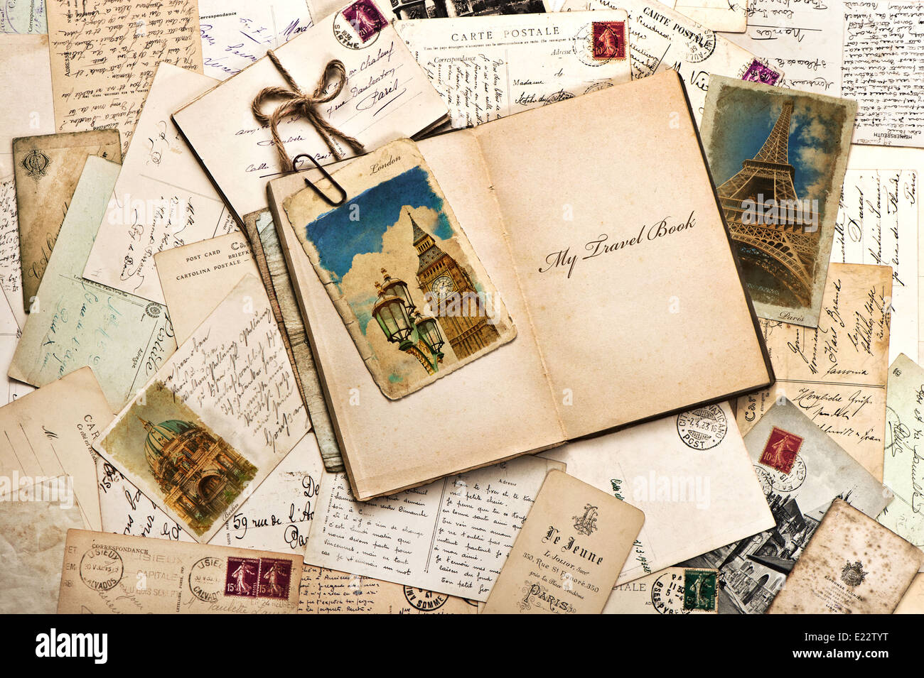 old postcards, letters, mails and open journal with sample text My Travel Book. vintage style travel background Stock Photo
