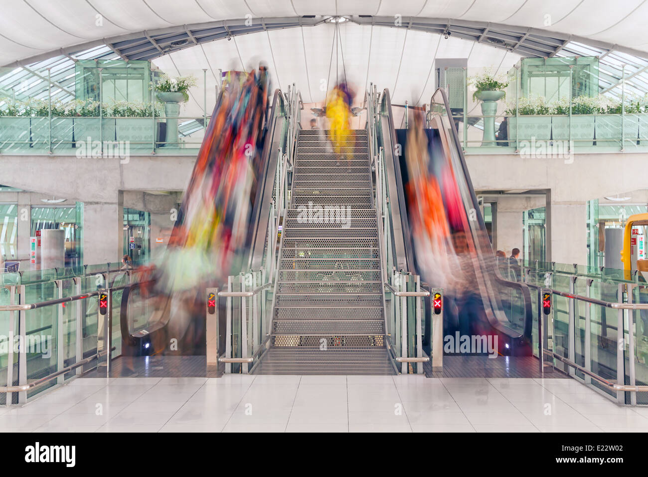 Escalator at the airport: passenger traffic, speed, transience. Stock Photo