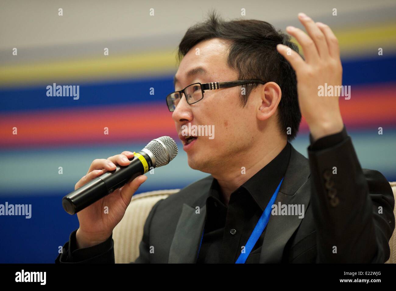 Xiamen, China's Fujian Province. 14th June, 2014. Director Lu Chuan addresses the 12th Straits Youth Forum in Xiamen, southeast China's Fujian Province, June 14, 2014. © Jiang Kehong/Xinhua/Alamy Live News Stock Photo