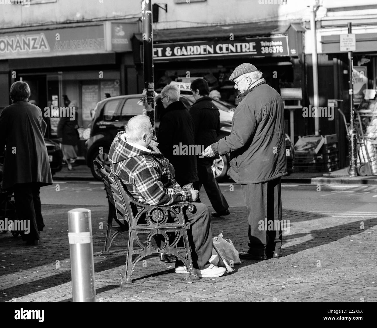 Muggers in Merthyr Tydfil are getting Older each year. Pair of old gents by seating area of town. Stock Photo