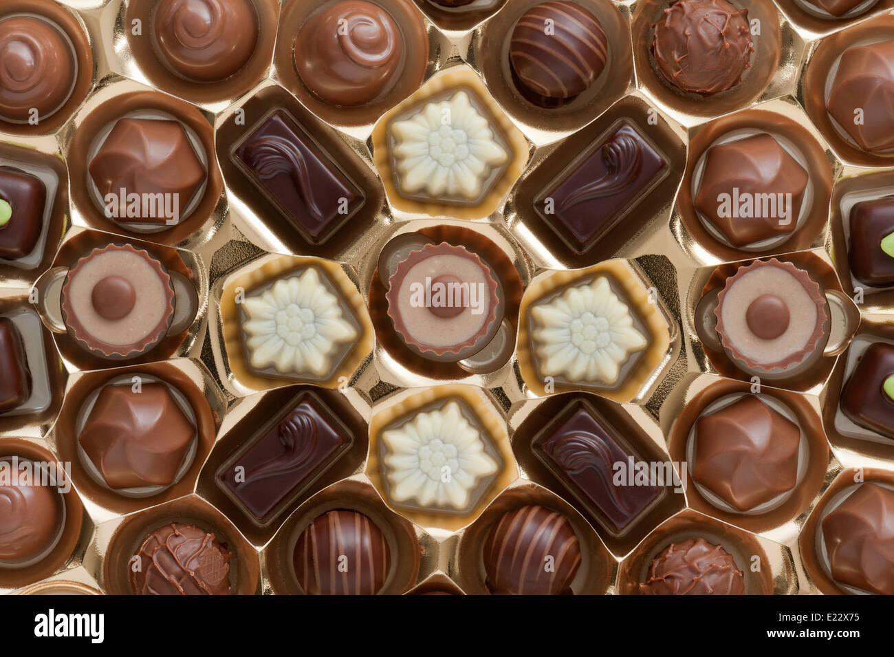 assorted chocolates confectionery in their gold box packaging Stock