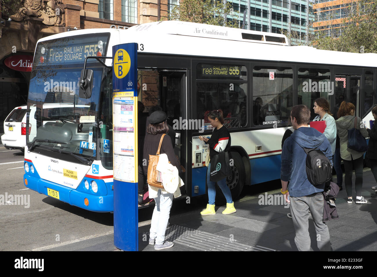 Commuters boarding a single decker Sydney bus in Chippendale,sydney, NSW,Australia Stock Photo