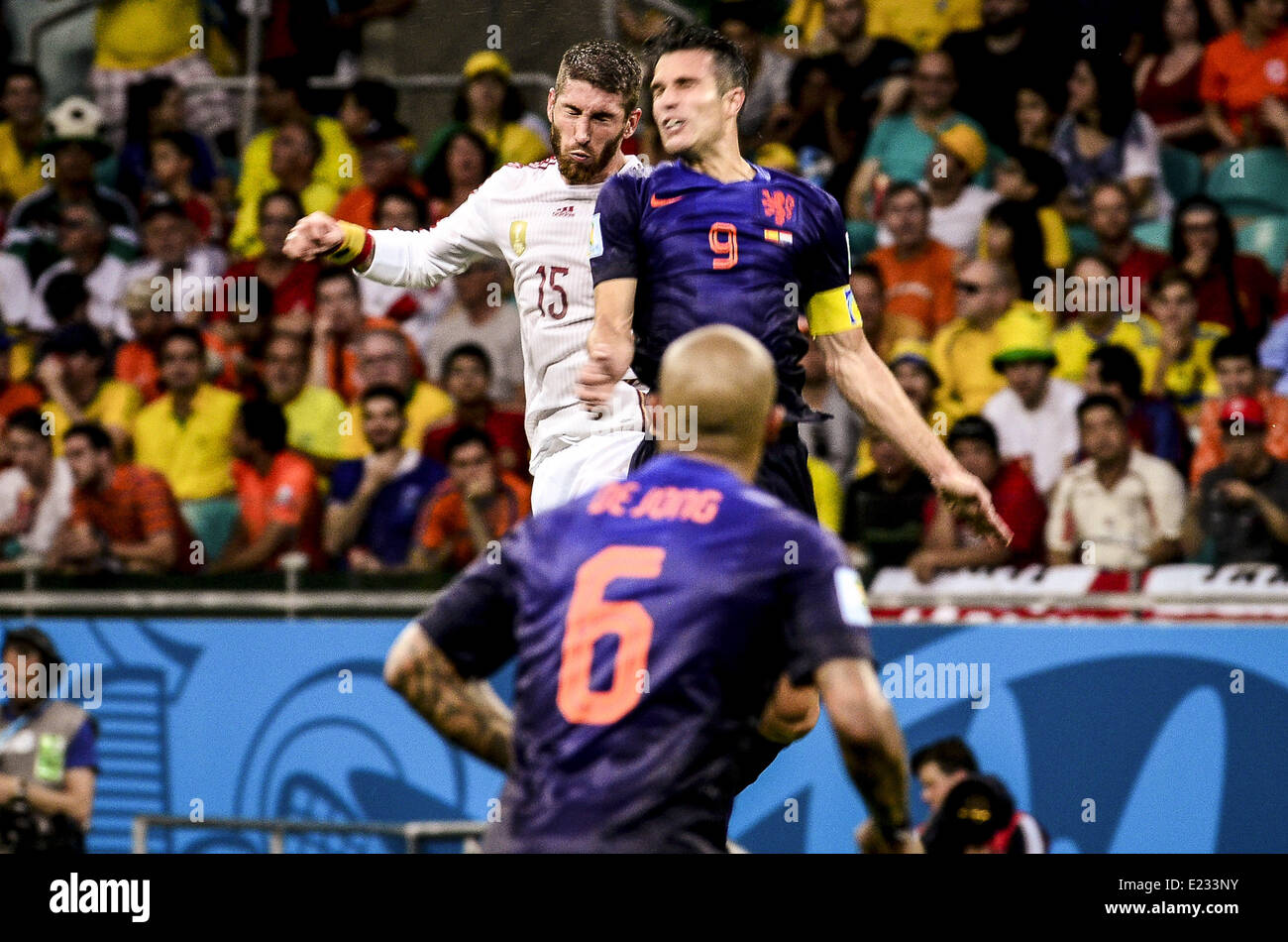 Salvador, Brazil. 13th June, 2014. Sergio Ramos and Robin Van Persie dispute the ball watched by Nigel de Jong at the #3 2014 World Cup match between Spain and Netherlands, in Salvador, Brasil, this friday 13th © Gustavo Basso/NurPhoto/ZUMAPRESS.com/Alamy Live News Stock Photo