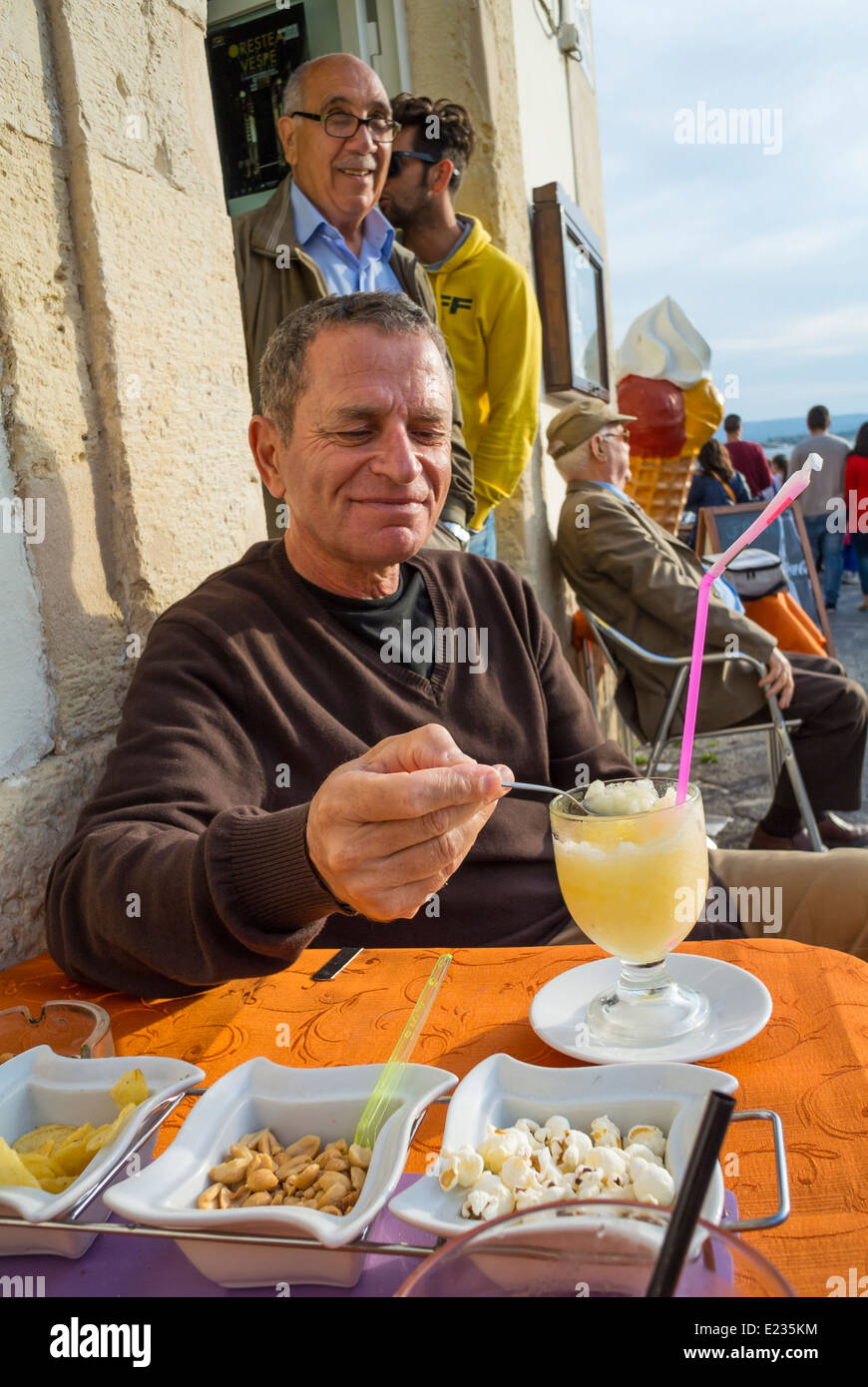 Man eating Granita,  Syracuse, Sicily, South Italy Stock Photo