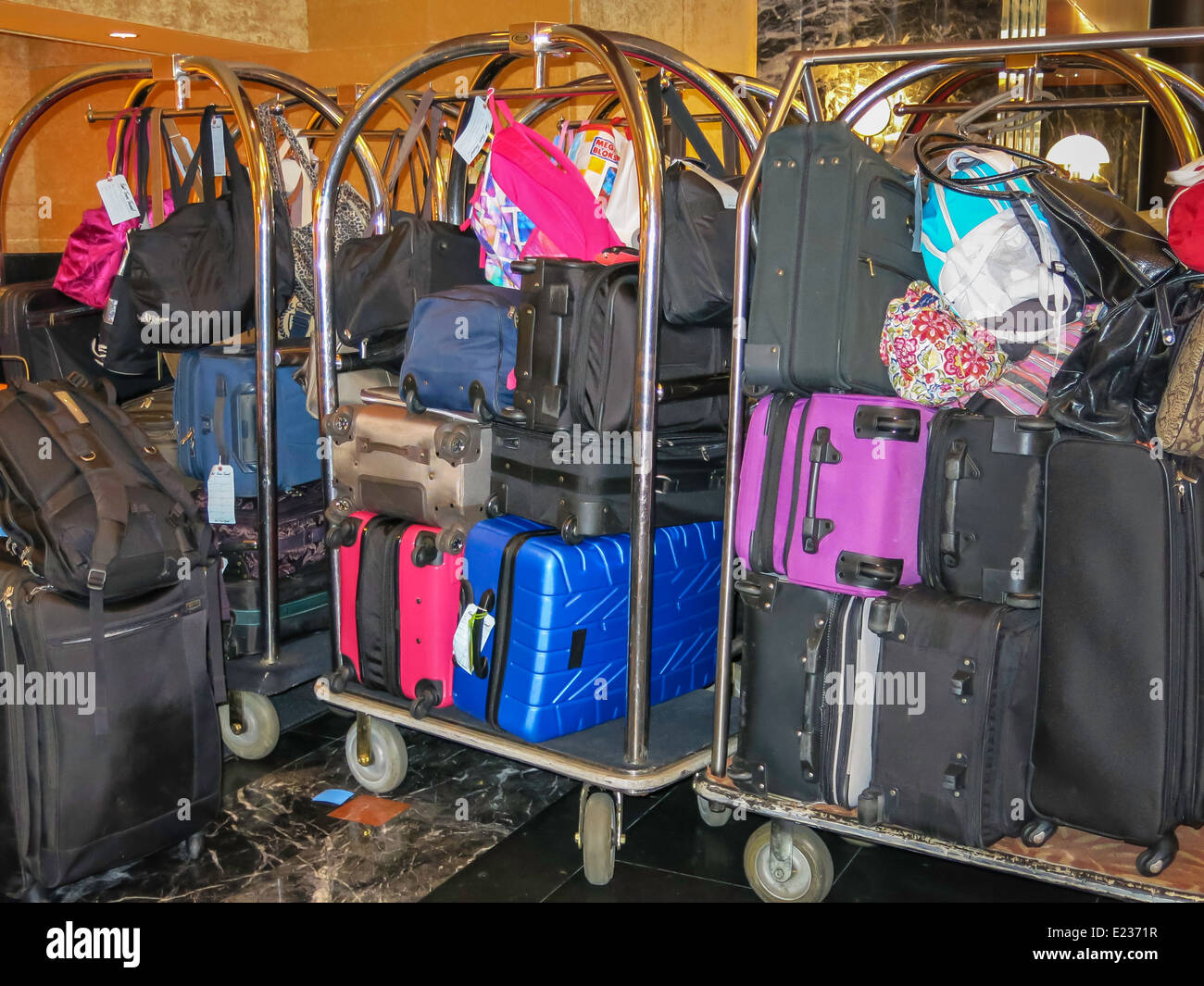 Luggage Carts Stacked with Suitcases in a Hotel Lobby Stock Photo Alamy