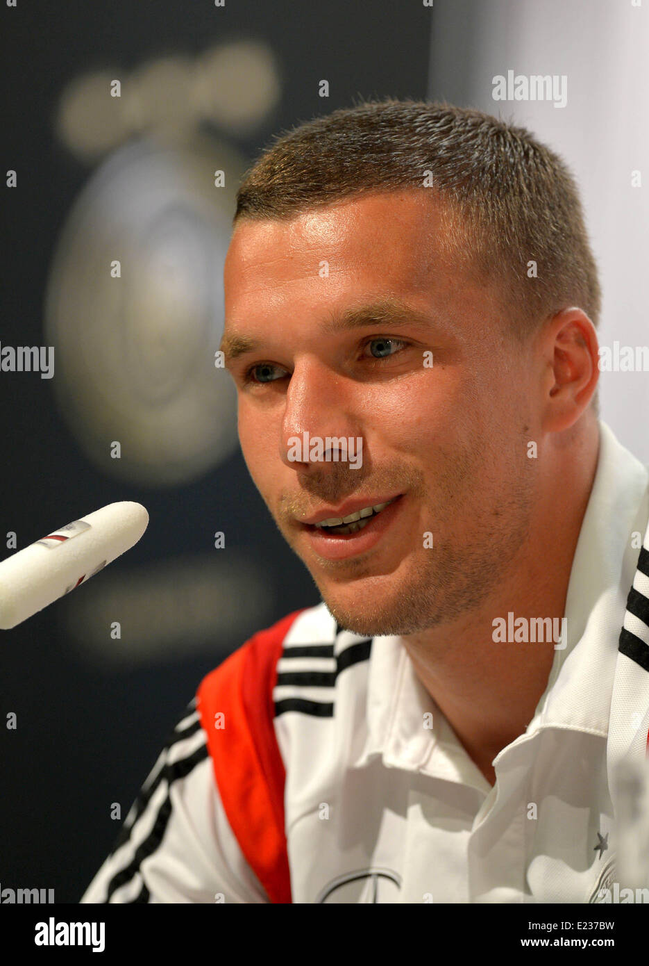 Lukas Podolski attends a press conference of the German national soccer team in Santo Andre, Brazil, 14 June 2014. The FIFA World Cup 2014 will take place in Brazil from 12 June to 13 July 2014. Photo: Thomas Eisenhuth/dpa Stock Photo