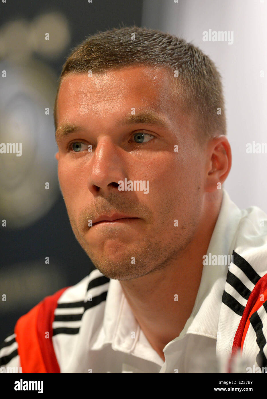 Lukas Podolski attends a press conference of the German national soccer team in Santo Andre, Brazil, 14 June 2014. The FIFA World Cup 2014 will take place in Brazil from 12 June to 13 July 2014. Photo: Thomas Eisenhuth/dpa Stock Photo