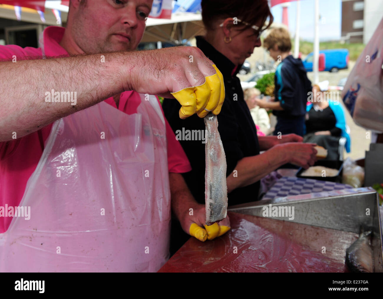 Den Haag, Netherlands. 14th June, 2014. A peddler shows handled herring