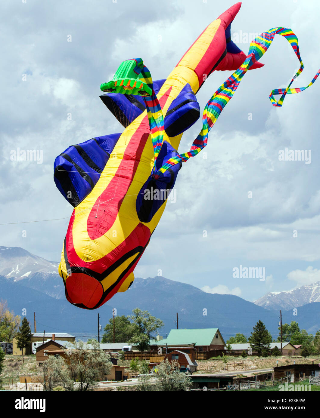 Fish and snake serpent shaped kites tangle & fall from the sky Stock Photo