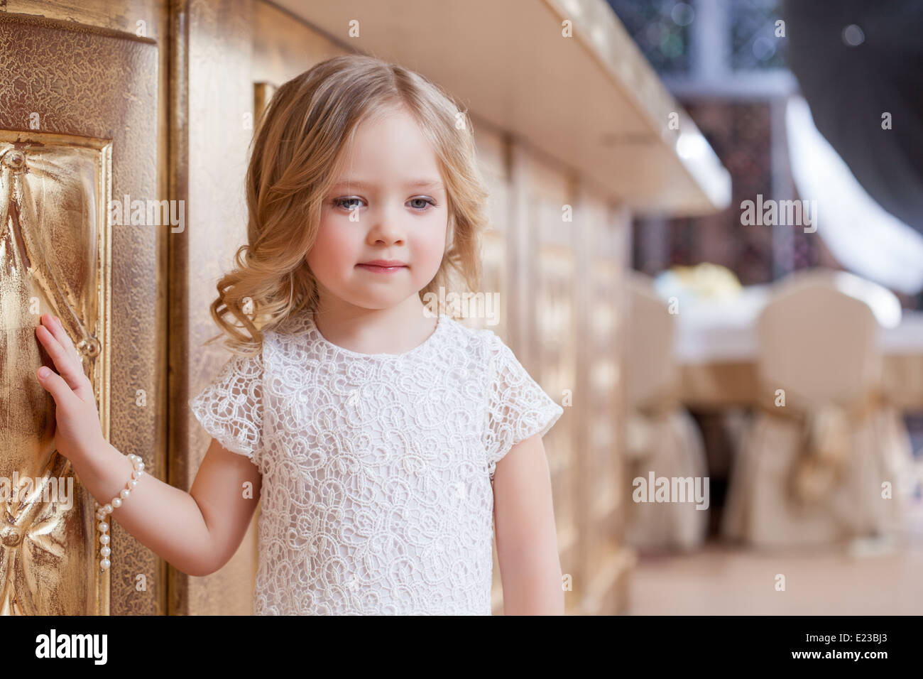 Portrait of elegant little girl posing at camera Stock Photo - Alamy