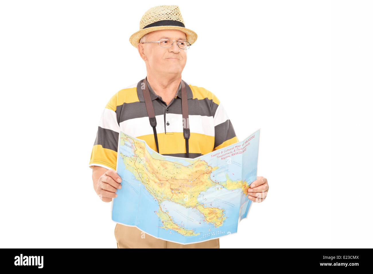 Mature tourist walking with map in his hands Stock Photo
