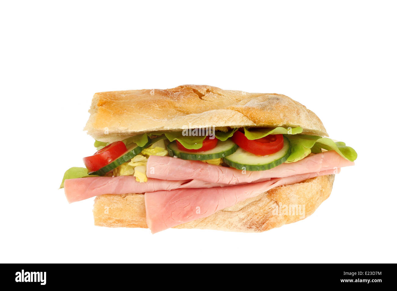 Ham and salad in a ciabatta roll isolated against white Stock Photo