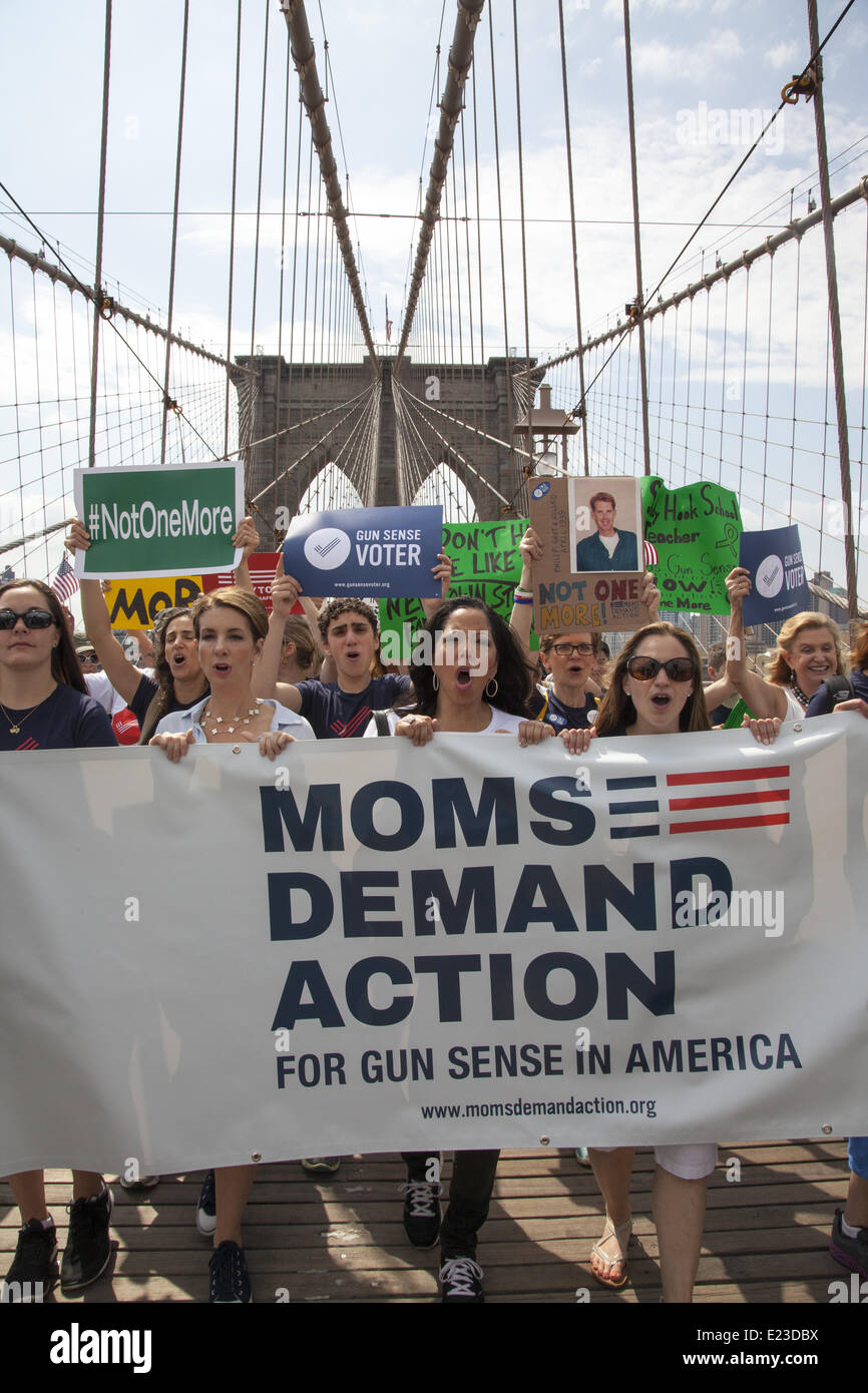 New York, USA. 14th June, 2014. At least a thousand activists joined 'Moms Demand Action' for gun sense in America. They marched across the Brooklyn Bridge and rallied near City Hall to pass meaningful gun legislation and stop the Wild West NRA mentality. Credit:  David Grossman/Alamy Live News Stock Photo