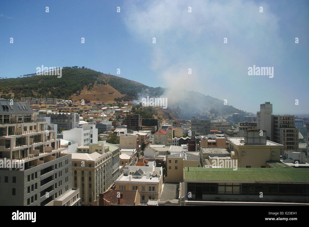 Aerial view of Cape Town CBD with a bush fire on Signal Hill in the background Stock Photo