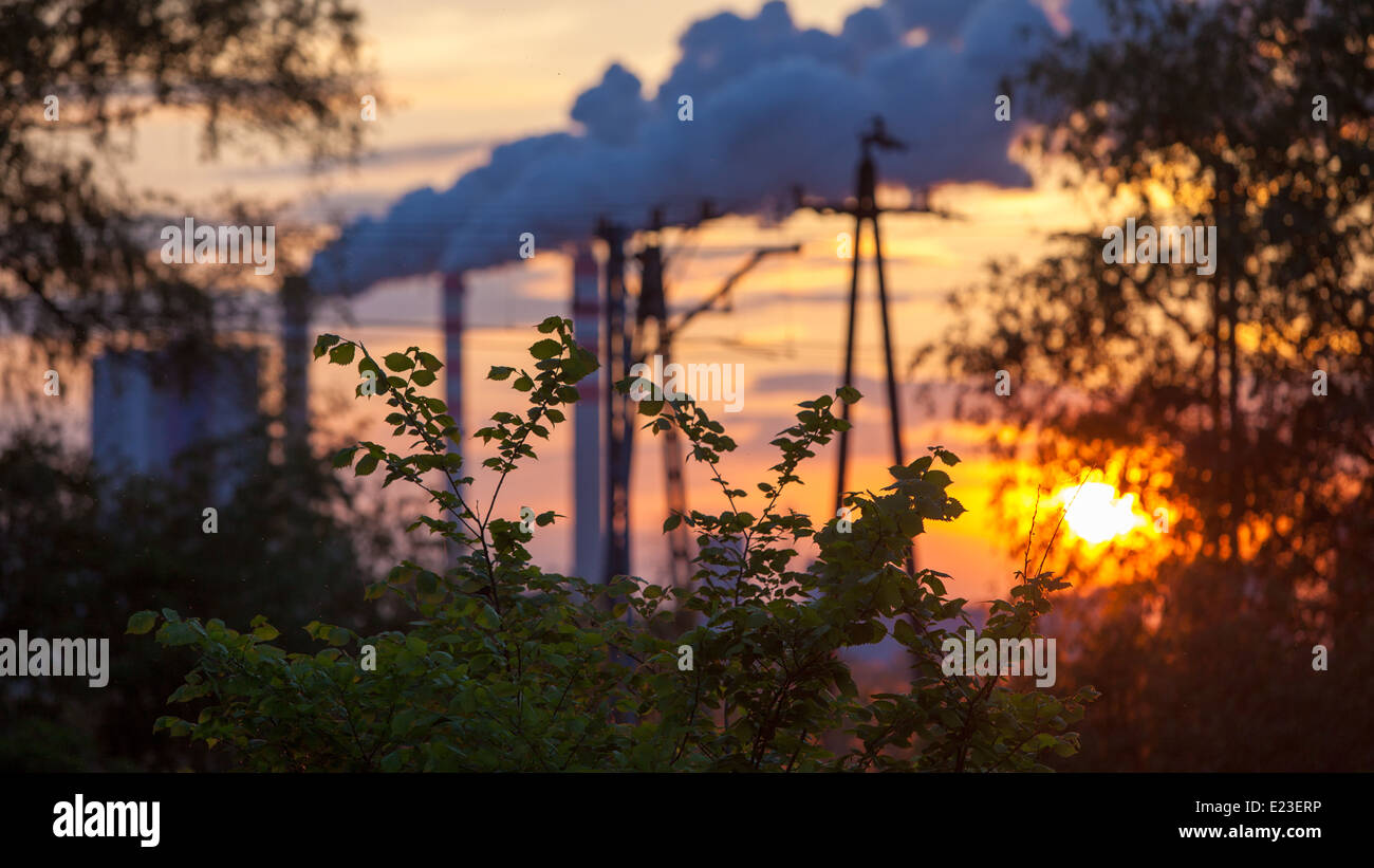 Energy. Smoke from chimney of power plant or station at the sunset ...