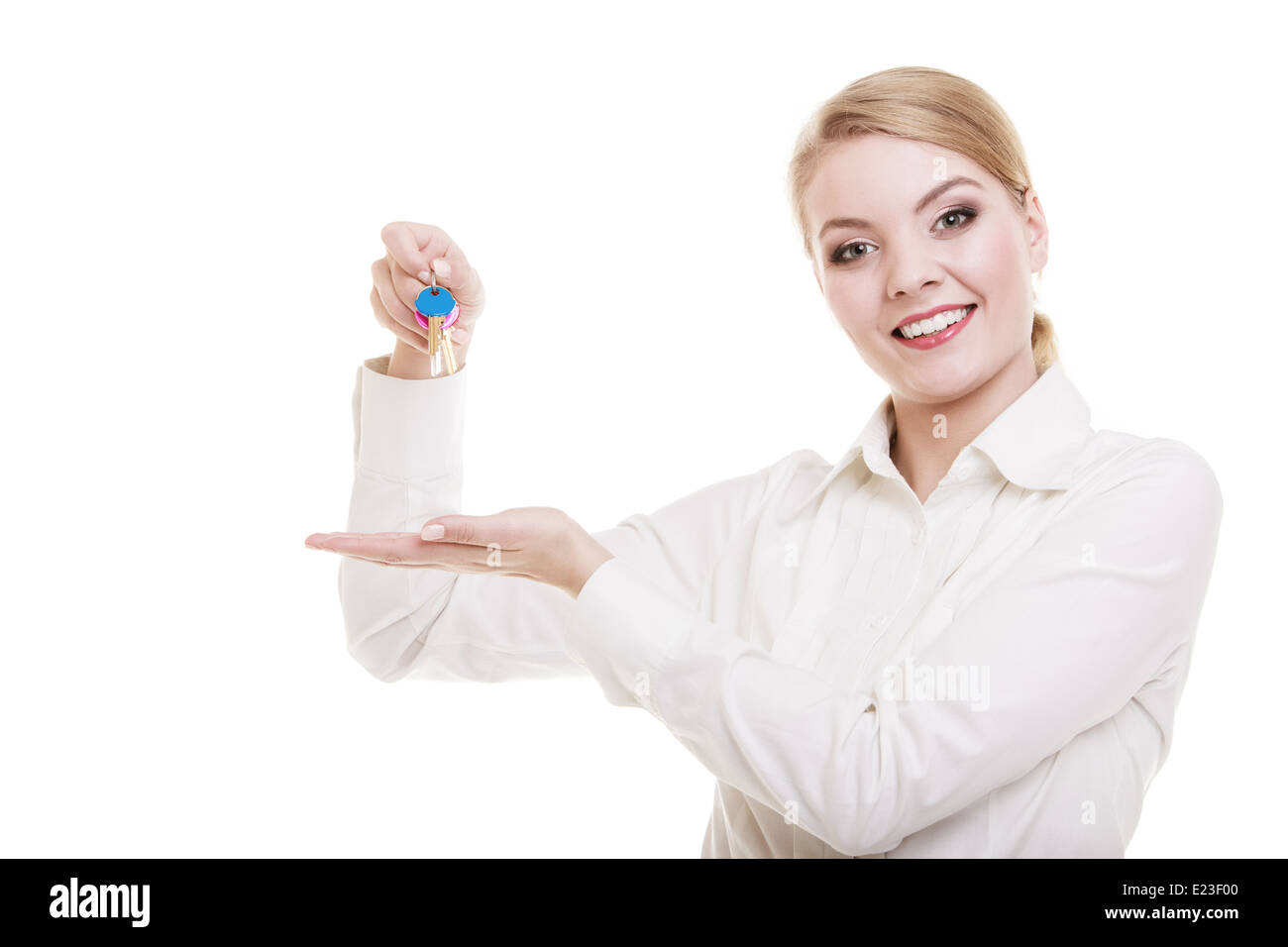 woman real estate agent holding set of keys to new house Stock Photo ...