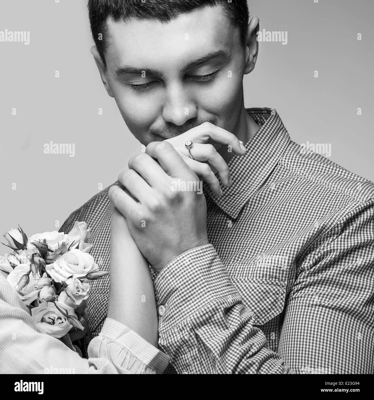 man kissing a woman's hand Stock Photo