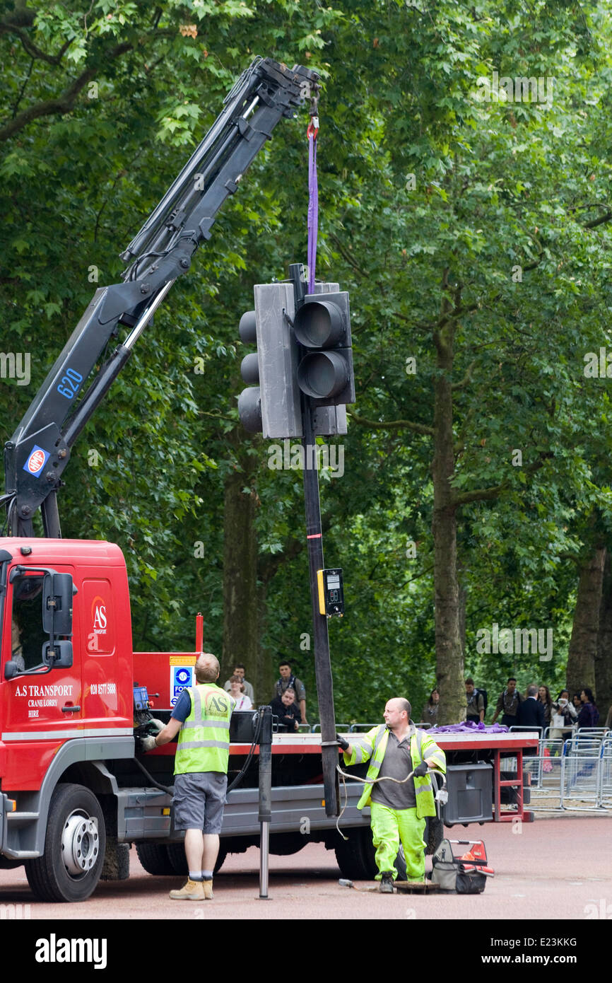 Workmen on the Mall removing traffic signals for Trooping the color London england Stock Photo