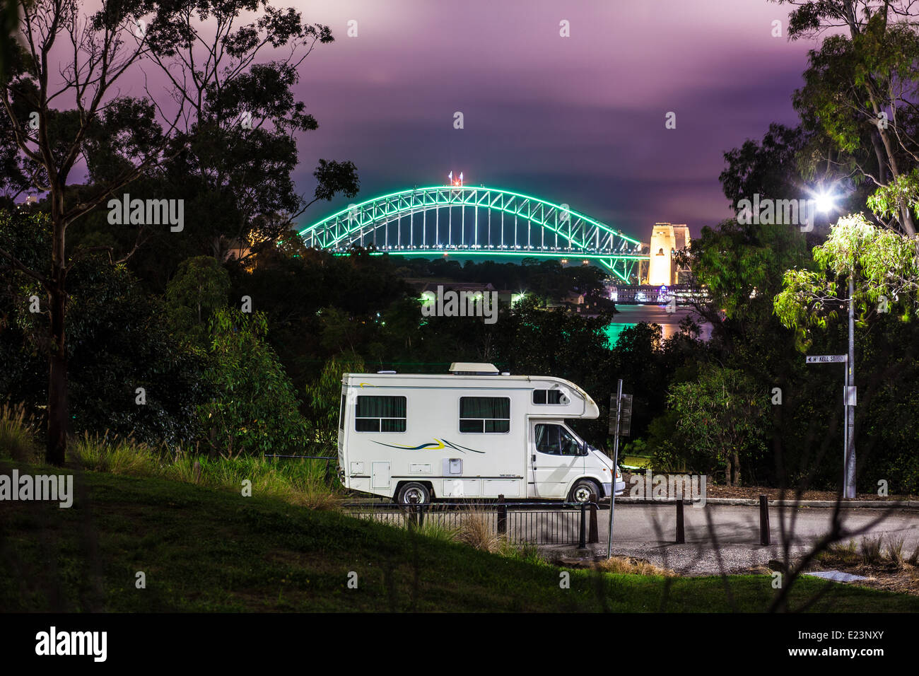 A motor-home camping in Mort Bay, Balmain in Sydney photographed against the backdrop of the Sydney Harbour Bridge Stock Photo