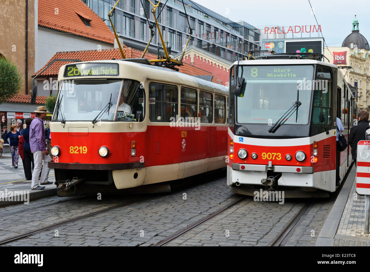 A modern and traditional red tram at the tram stop in Prague (Praha), Czech  Republic Stock Photo - Alamy