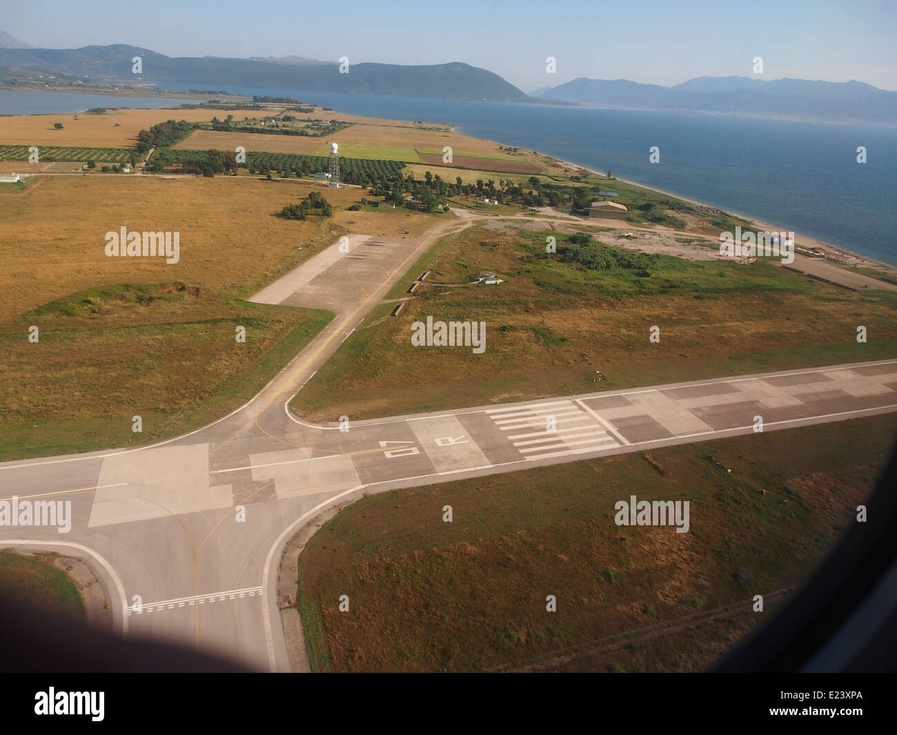 Aktion National Airport, runway 07R seen after takeoff from 25R Stock Photo