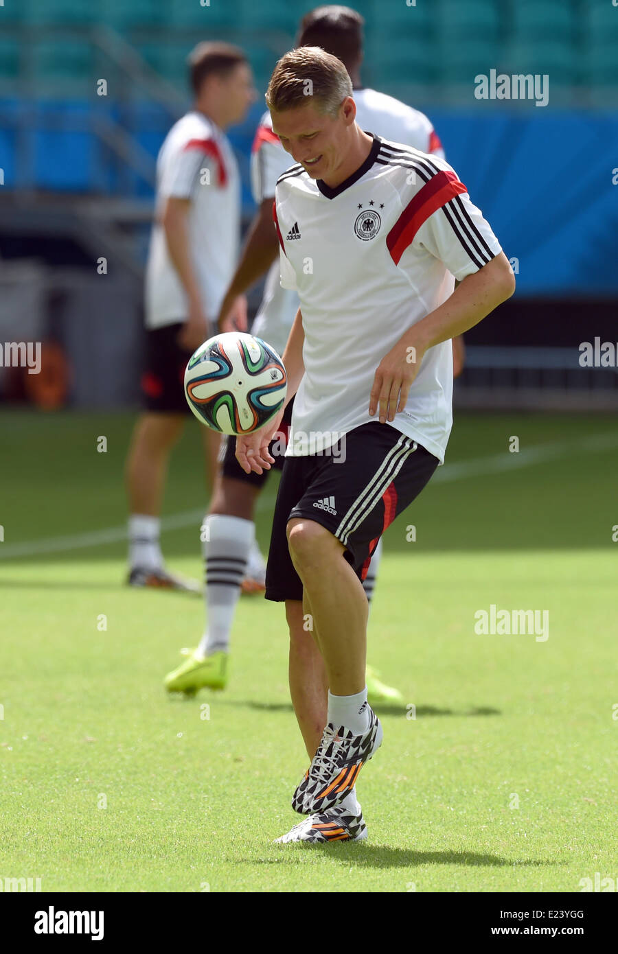 Salvador da Bahia, Brazil. 15th June, 2014. Bastian Schweinsteiger in action during a training session of the German national soccer team at the Arena Fonte Nova Stadium in Salvador da Bahia, Brazil, 15 June 2014. Germany will face Portugal in their group G preliminary round match at the FIFA World Cup 2014 on 16 June 2014 in Salvador da Bahia. Photo: Marcus Brandt/dpa (RESTRICTIONS APPLY: Editorial Use Only, not used in association with any commercial entity - Images must not be used in any form of alert service or push service of any kind including via mobile alert services, downloads to mob Stock Photo