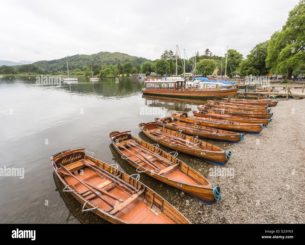 Wooden rowing boats lined up on the shore at Waterhead, Ambleside, Lake