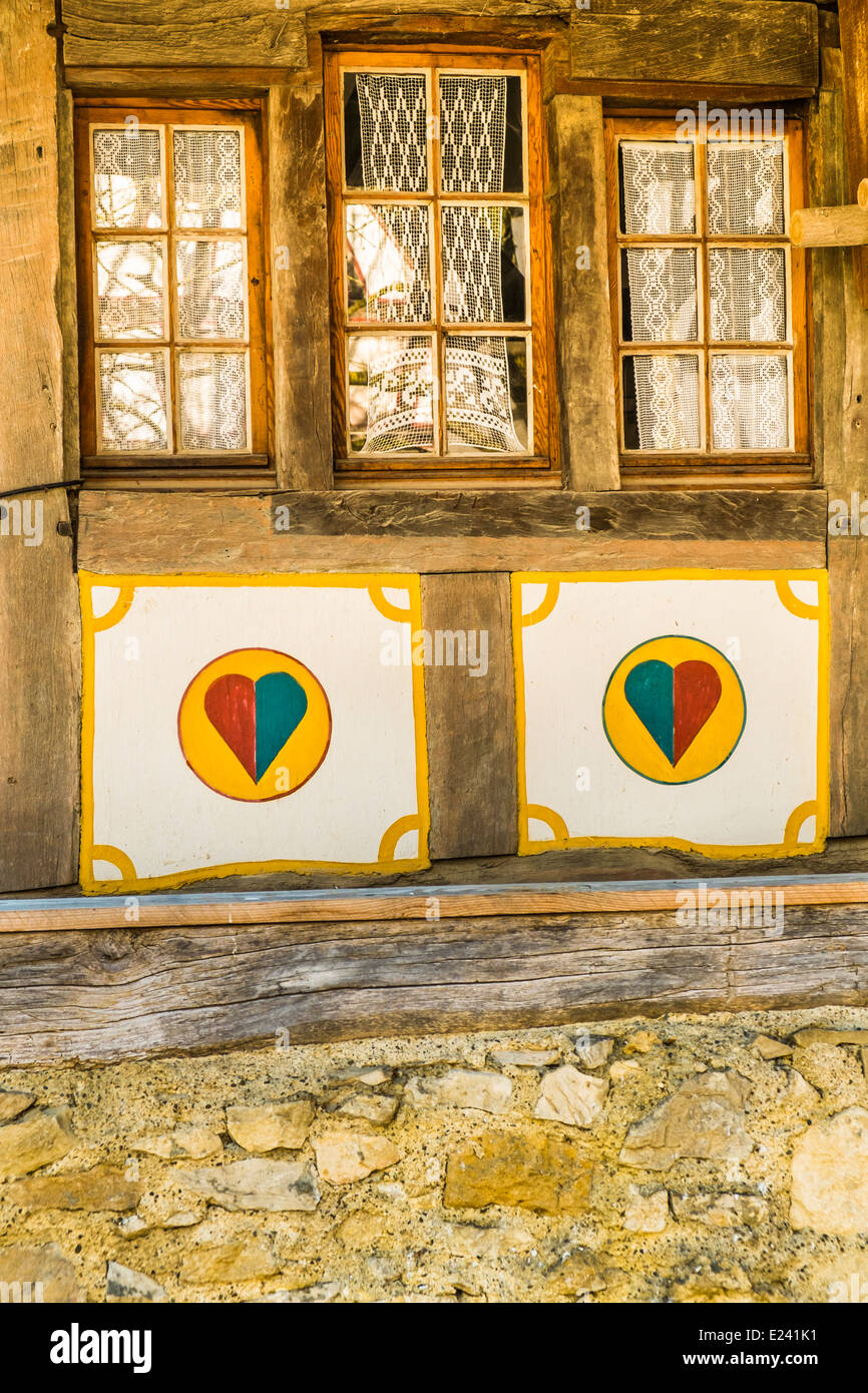 historical half-timbered facade decorated with ornaments and colored hearts at the écomusée d´alsace, ungersheim, alsace Stock Photo